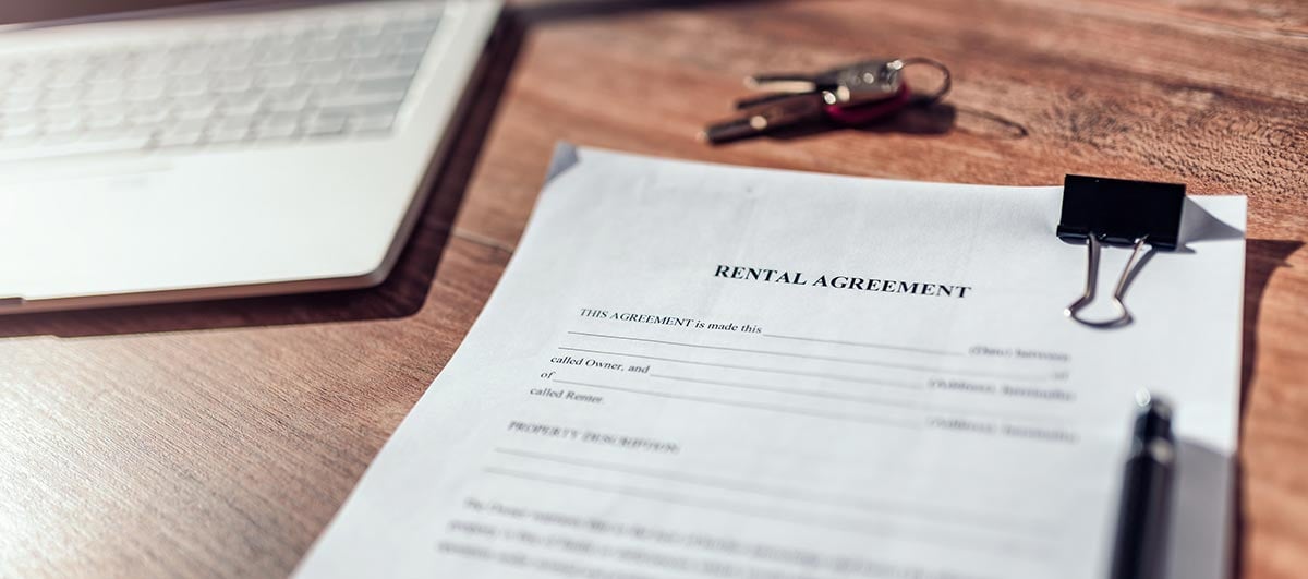 how to improve tenant retention - rental agreement on a table